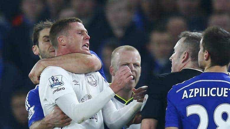 Branislav-Ivanovic-of-Chelsea-grapples-with-Everton-s-James-McCarthy-during-their-English-Premier-League-soccer-match-at-Stamford-Bridge-London
