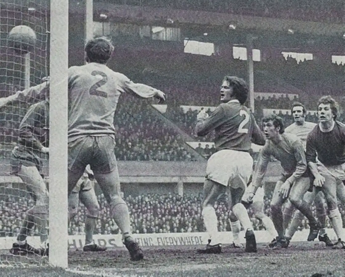 1712 06.02.71 Royle v Huddersfield - LAST IN SEQUENCE - Tommy Wright and Joe Royle watch as J...webp