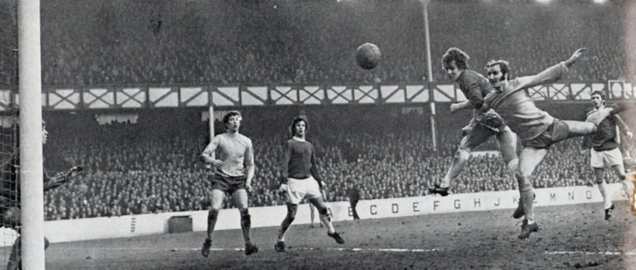 1713 06.02.71 Royle v Huddersfield (H) - FIRST IN SEQUENCE - Joe Royle meets a chip from Coli...webp