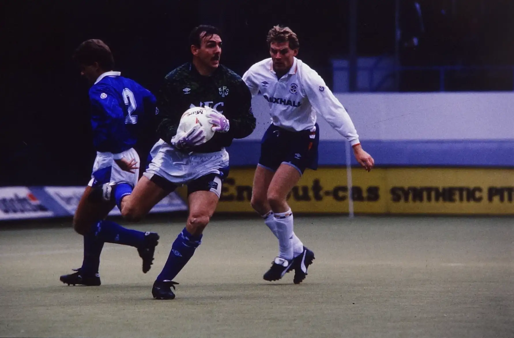 MAIN+PHOTO+P890+Lars+Elstrup+making+sure+Neville+Southall+does+not+drop+the+ball.webp