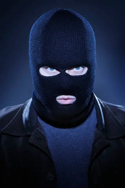 man-wearing-ski-mask-and-staring.webp