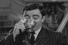 gomez-addams-gomez-addams-smoke.gif
