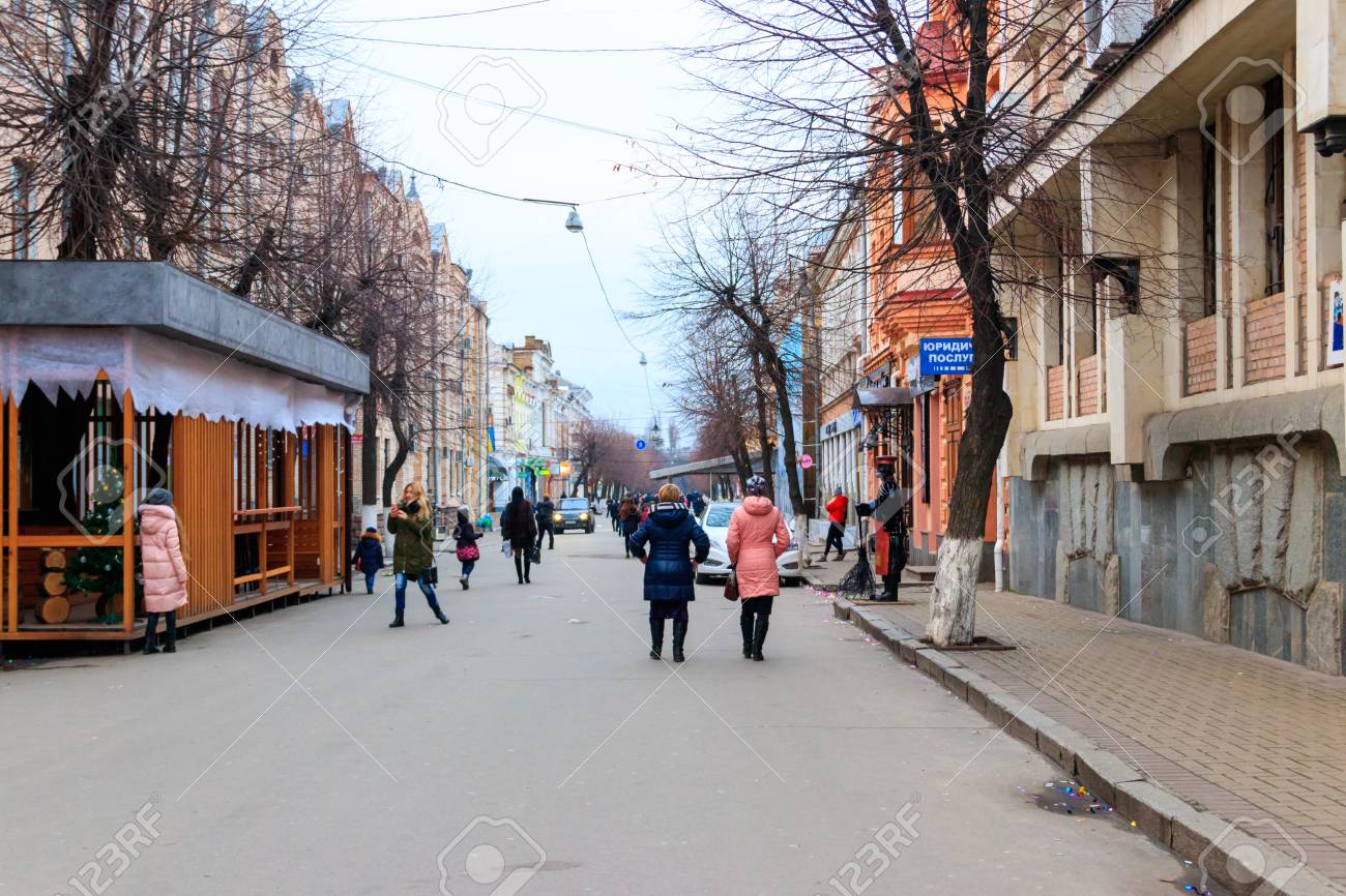 93038602-kropyvnytskyi-ukraine-january-1-2018-people-walking-on-pedestrian-walkway-in-public-city-park.jpg