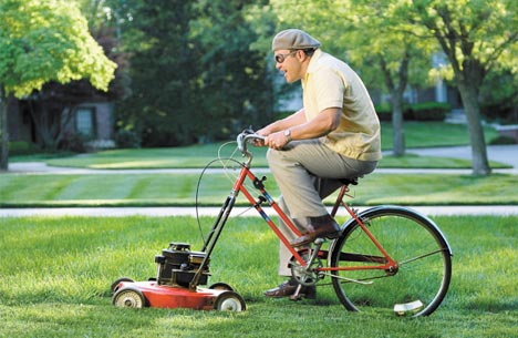 guy-riding-bicycle-lawnmower.jpeg