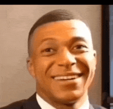 mbappe-laugh-mbappe-laughing-then-scared.gif