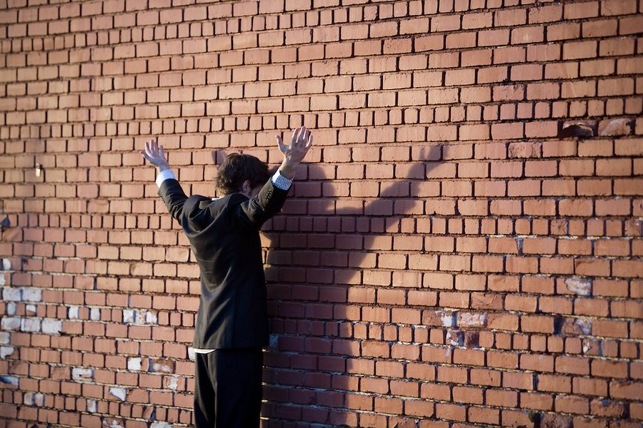 manfacingbrickwall.jpg