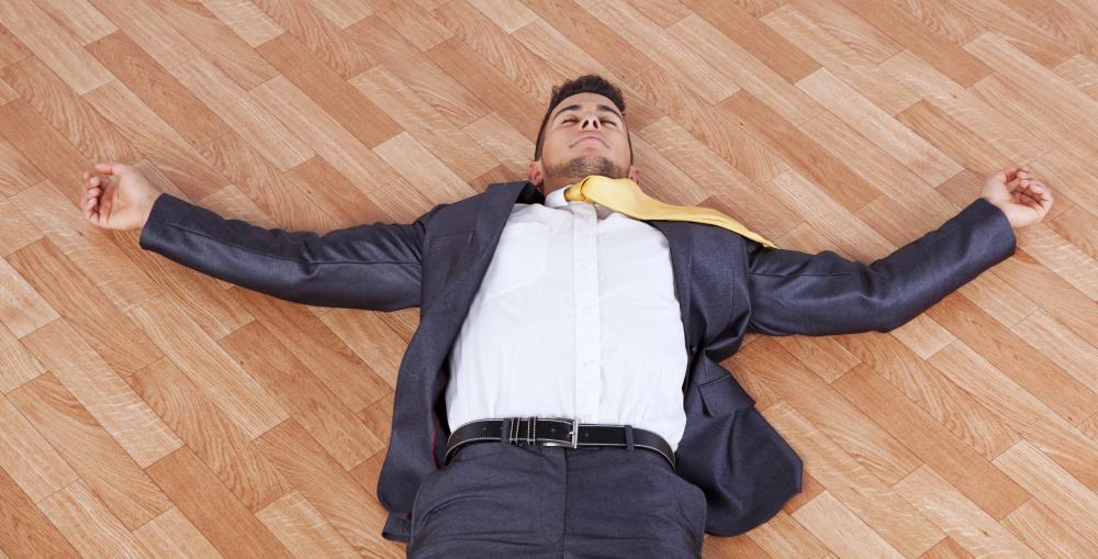man-in-suit-lying-on-floor-on-back.jpg