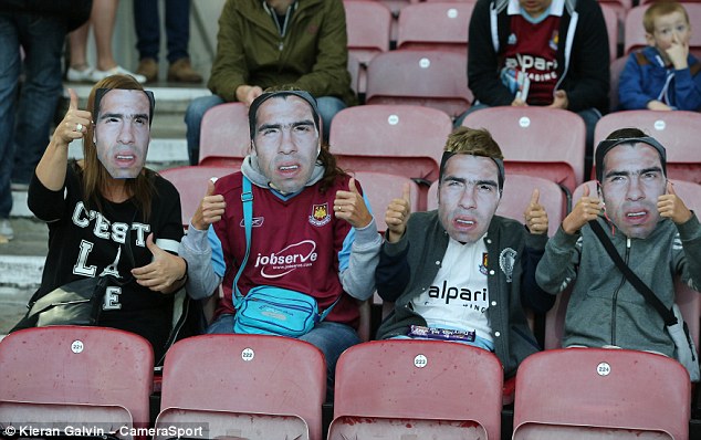 1409083532049_wps_4_West_Ham_Fans_wearing_Car.jpg