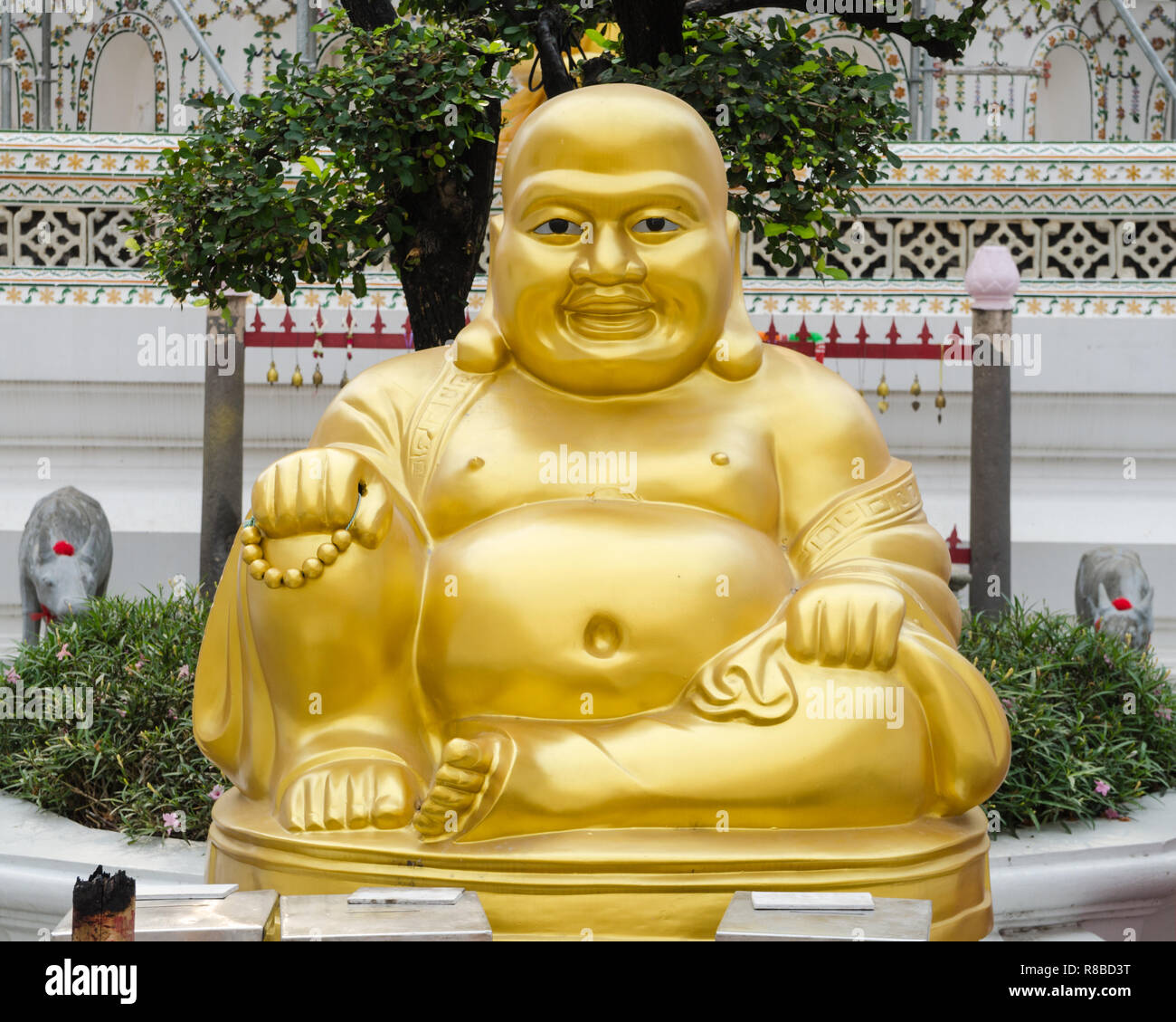 gilded-fat-buddha-statue-at-wat-arun-bangkok-thailand-R8BD3T.jpg