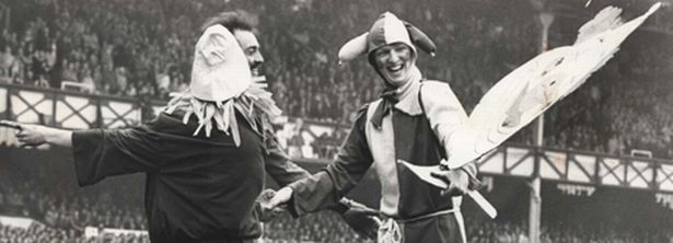 bruce-grobbelaar-is-presented-with-a-clown-s-outfit-at-goodison-196551302.jpg