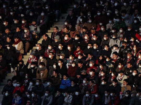 Fans-wearing-face-masks-at-a-J-League-football-match-between-Vissel-Kobe-and-Yokohama-F-Marinos-in-February_1707c7248c9_medium.jpg