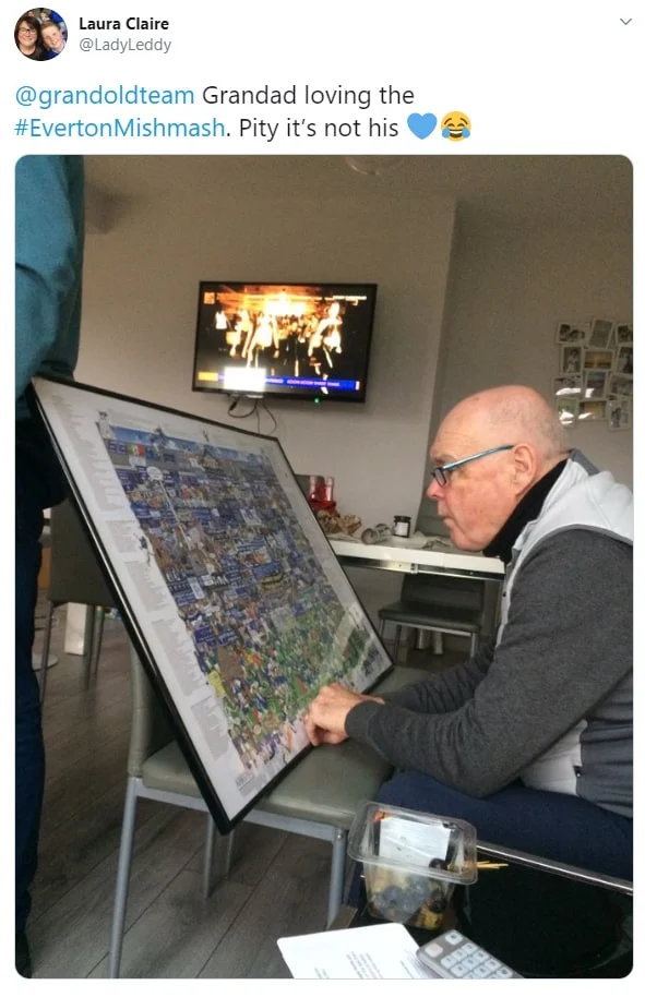 An older Everton fan closely examining the details on the Everton Mishmash illustration, making it one of the best Everton gifts for Grandad.